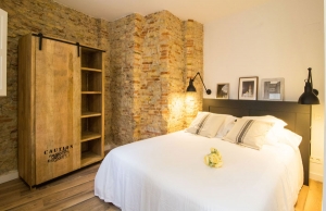 Dormitorio en Madrid con decoración raw style