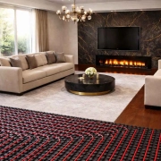 Salón moderno de lujo con dos sofás enfrentados y mesa de centro sobre alfombra blanca, con una zona donde se ve el suelo radiante con tuberías instaladas; imagen representativa para analizar qué es mejor instalar aerotermia o gas natural en una vivienda.